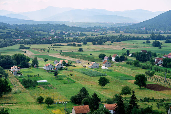 Rectangles of fields in a village in the vicinity of Niksic. Montenegro. High quality photo