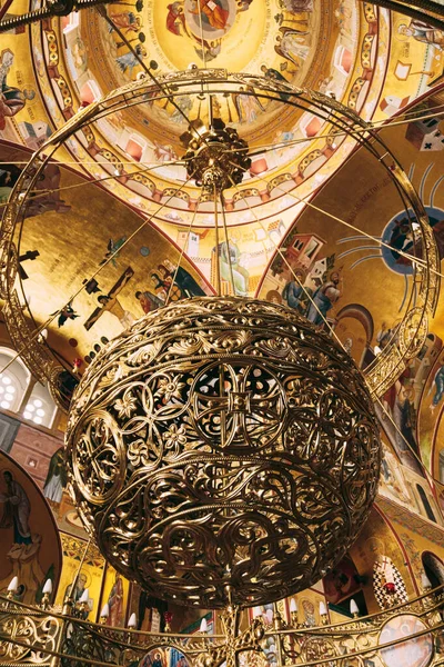 Golden ball-shaped chandelier under the arches of the Church of the Resurrection of Christ in Podgorica — Foto Stock