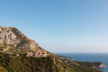 Aerial view of a settlement in the mountains above the sea