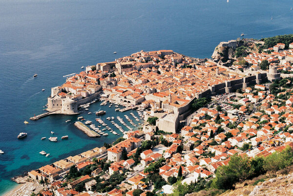 Pier with boats near the old stone houses of Dubrovnik. Croatia Stock Picture