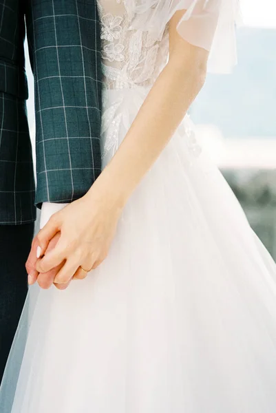 Bride White Dress Holds Groom Hand Close High Quality Photo — Stock fotografie