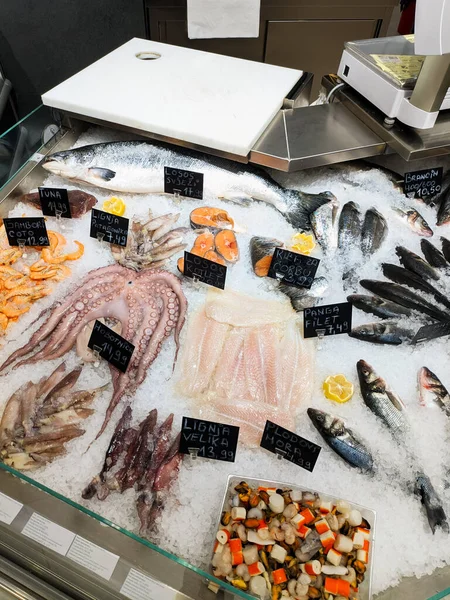 Seafood lies in ice on a supermarket counter. High quality photo