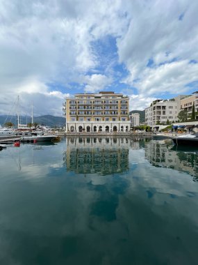 Regent Hotel with a jetty against the sky. Porto, Montenegro. High quality photo