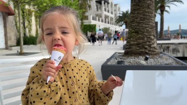 Little Girl Eats Ice Cream Cone Biting High Quality Fullhd — Wideo stockowe