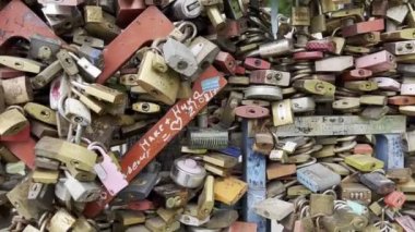 Colorful locks on a metal fence. Budapest, Hungary. High quality 4k footage