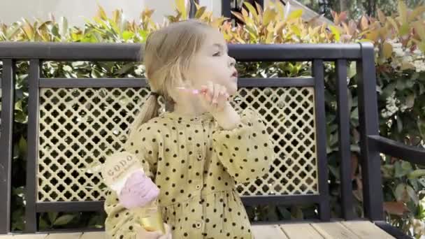Little Girl Slowly Eats Ice Cream Cone Spatula High Quality — Vídeos de Stock