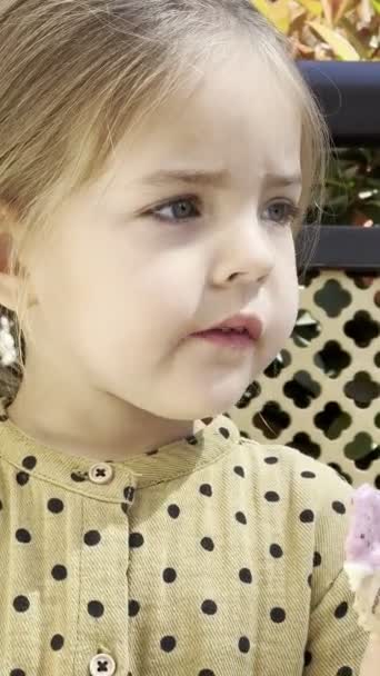 Little Girl Biting Waffle Slice Ice Cream High Quality Footage — Vídeos de Stock