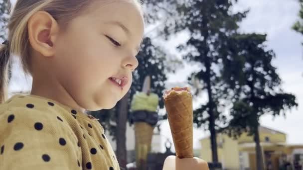 Little Girl Biting Ice Cream Waffle Cup High Quality Footage — Videoclip de stoc