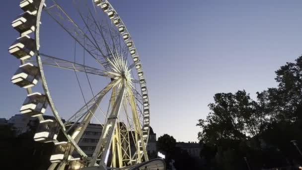 Large white Ferris wheel with illuminated booths. Budapest, Hungary. High quality 4k footage
