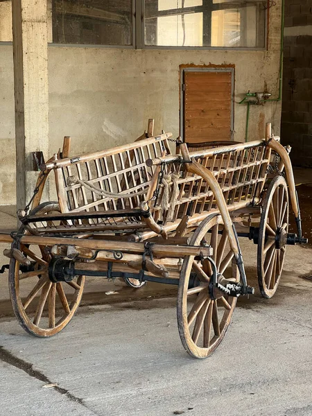 Wooden horse cart stands in the garage. High quality photo