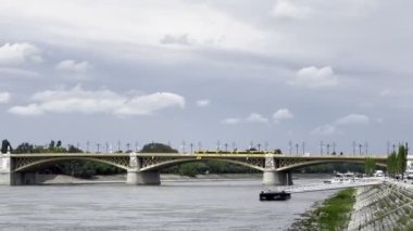 Public transport travels along the Margaret Bridge over the Danube. Budapest, Hungary. High quality 4k footage