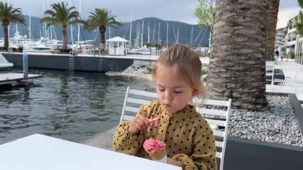 Little Girl Eating Ice Cream Spoon Pier High Quality Fullhd — стоковое видео