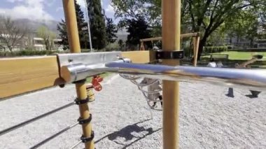 Little girl climbs the stairs on the playground. High quality 4k footage