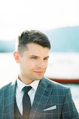 Portrait of a man in a gray plaid jacket. High quality photo