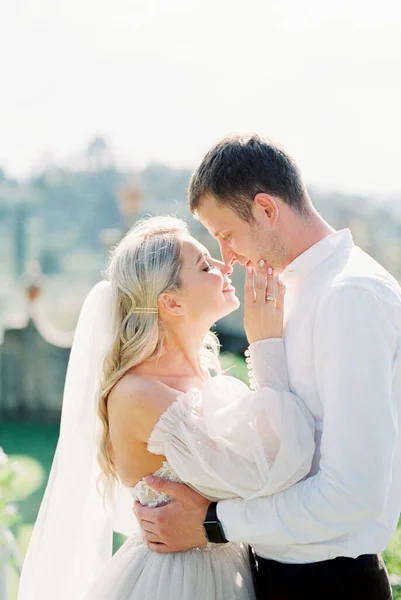 Groom Hugs Bride Touching Her Nose His Portrait High Quality — Φωτογραφία Αρχείου