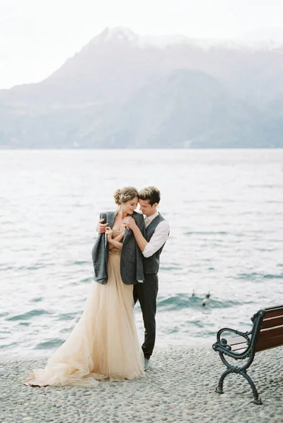 Groom Put Jacket Shoulders Bride Lake Shore High Quality Photo — стоковое фото