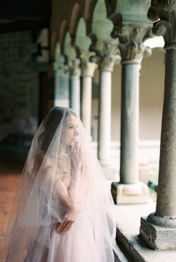 Bride in a veil on the terrace of an old villa. High quality photo