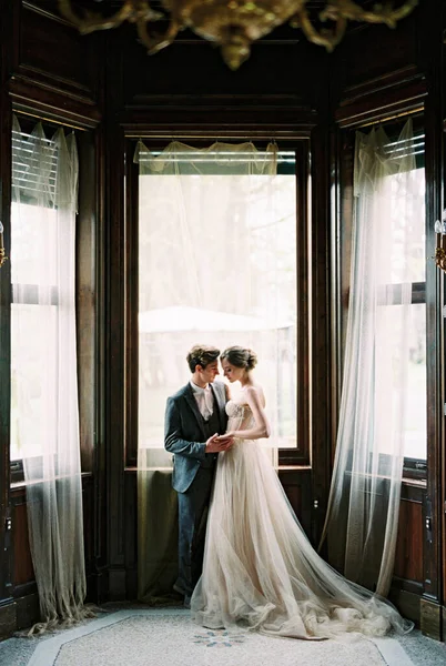 Groom Holds Hands Bride Standing Window Old Villa Como Italy — 스톡 사진
