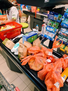 Different products on the cashier tape in the supermarket. High quality photo