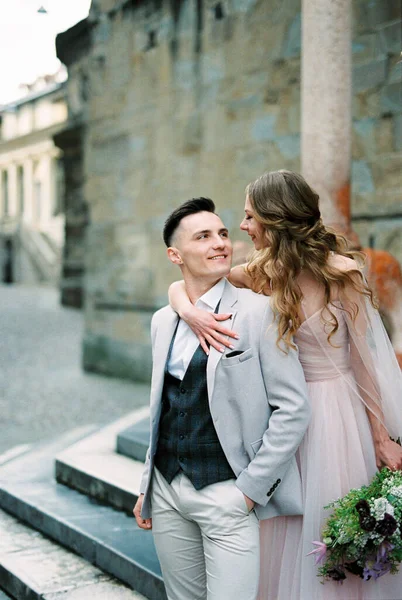Smiling Bride Hugs Groom Steps Bergamo Italy High Quality Photo — стокове фото