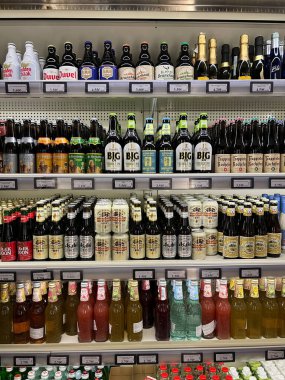 Shelves with a variety of alcohol in the supermarket. Close-up. High quality photo