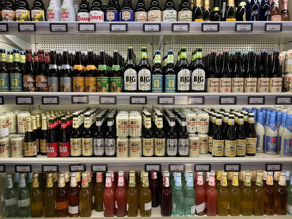 Large selection of low-alcohol drinks and beer on the shelves in the supermarket. High quality photo