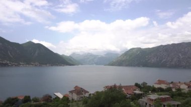 Clouds float across the sky over the bay. Timelapse. High quality 4k footage