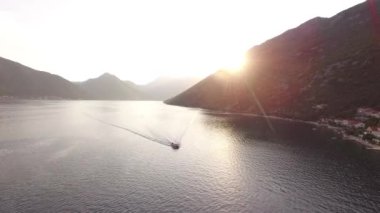 Tourist boat sails along Kotor Bay. High quality 4k footage