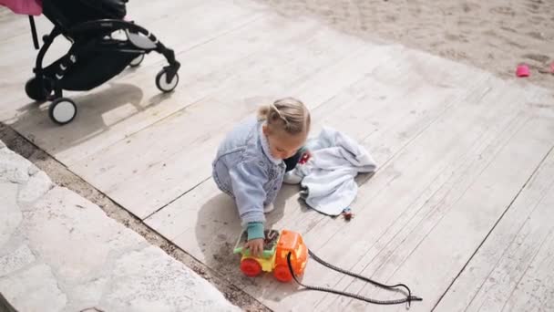 Little Girl Plays Sand Beach Two Year Old Child Denim — Stock Video