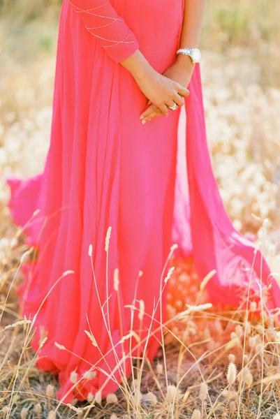 Woman Red Dress Stands Field Dry Grass Close High Quality — Zdjęcie stockowe