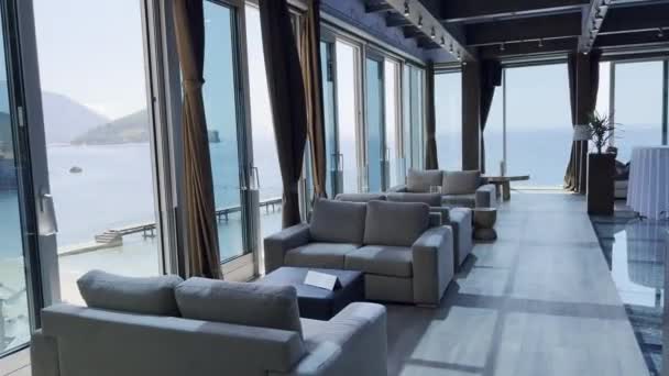 Glazed Restaurant Terrace Soft Chairs Tables Sea High Quality Footage — Vídeo de stock