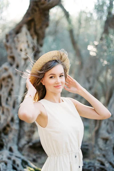 Young Woman Holding Straw Hat Her Head Wind High Quality — Stok Foto