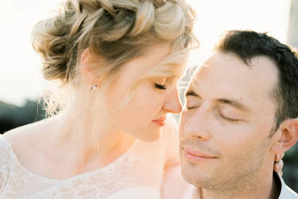 Bride Touches Groom Cheek Her Nose Sitting His Arms Portrait — Stok Foto