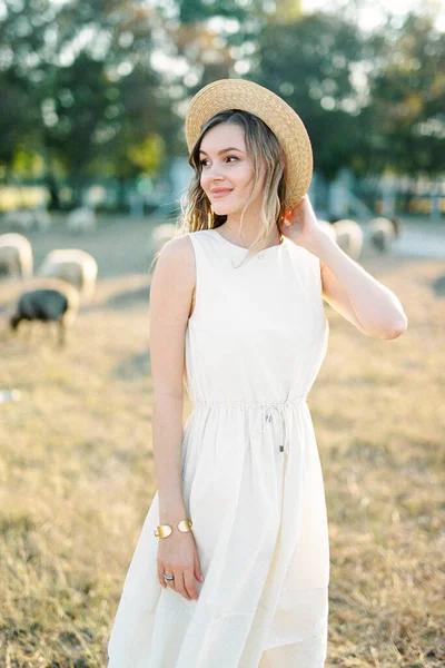 Girl Straw Hat Stands Grazing Sheep High Quality Photo — Stok Foto