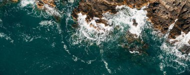 Aerial view of a blue beach with beautiful rocks. High quality photo