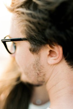 Male face with glasses. Side view. Close-up. High quality photo