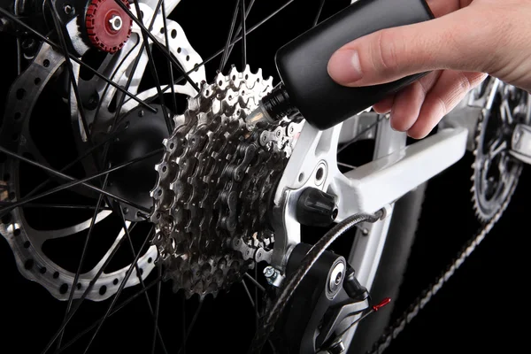 Bicycle gears and rear derailleur oiling — Stock Photo, Image