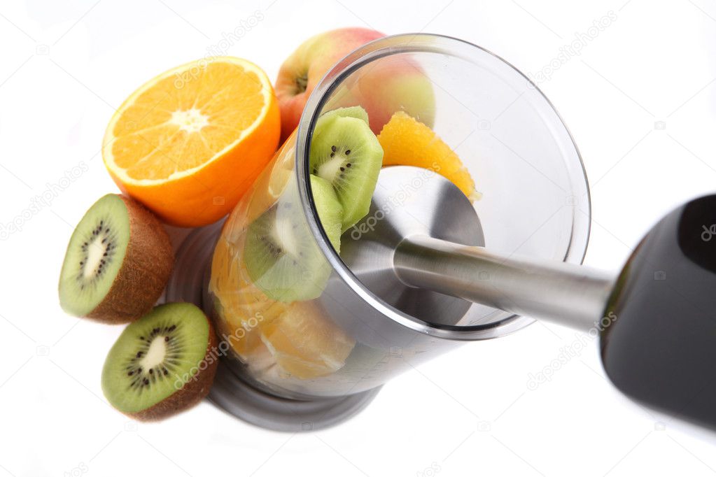 Fresh fruits mixing with hand blender