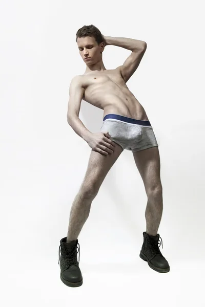 Belo modelo masculino muscular em cuecas pretas em pos provocativos Imagens De Bancos De Imagens Sem Royalties