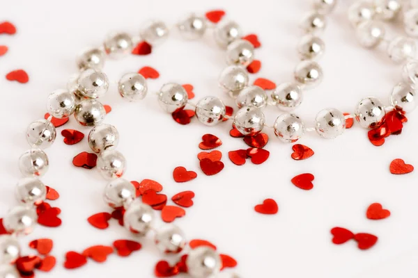 Glitter hearts and pearls — Stock Photo, Image