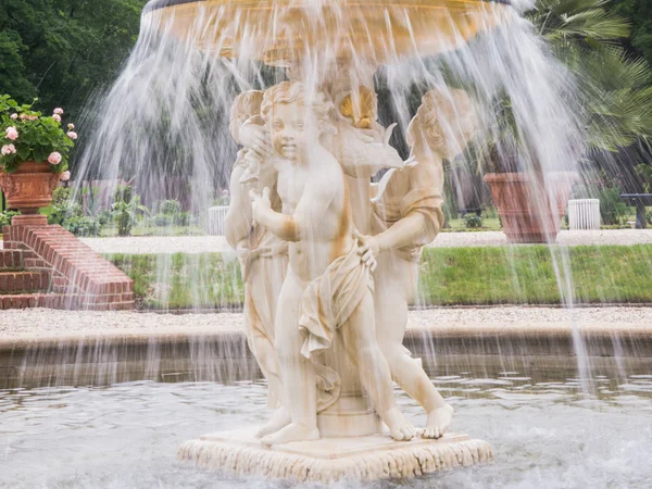 Cherub fountain with blurred water flowing — Stock Photo, Image