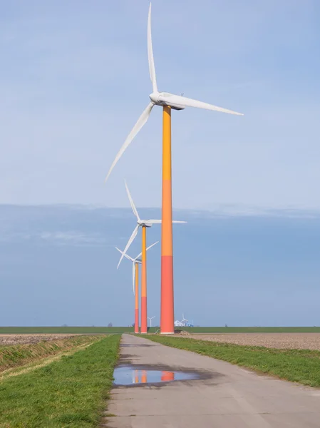 Brightly colored wind turbine in Dutch landscape — Stock Photo, Image