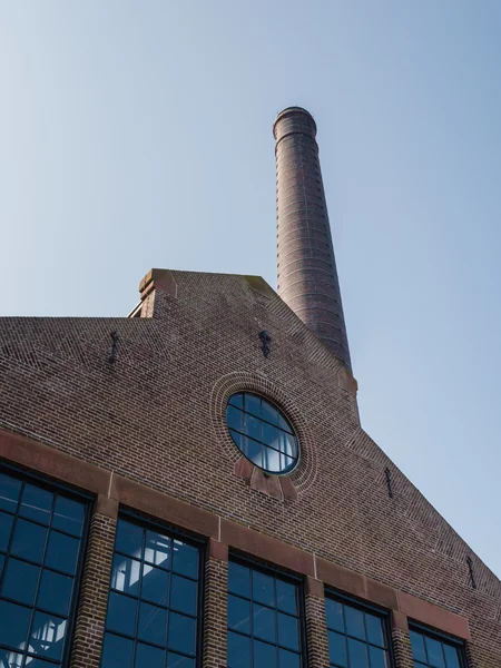 Industrial building with chimney — Stock Photo, Image