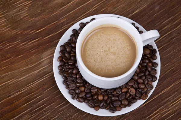 Coffee cup with beans — Stock Photo, Image