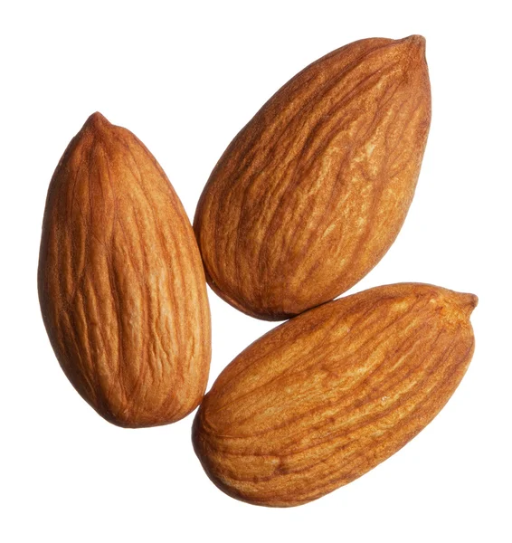 Trois amandes isolées sur fond blanc — Photo