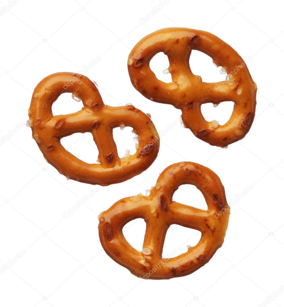 Three pretzels isolated on white background, close-up