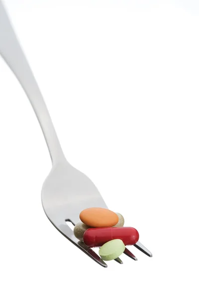 Fork and pills isolated on white background — Stock Photo, Image