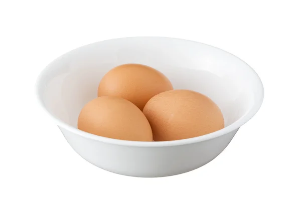 Three brown eggs in a bowl isolated on white background — Stock Photo, Image