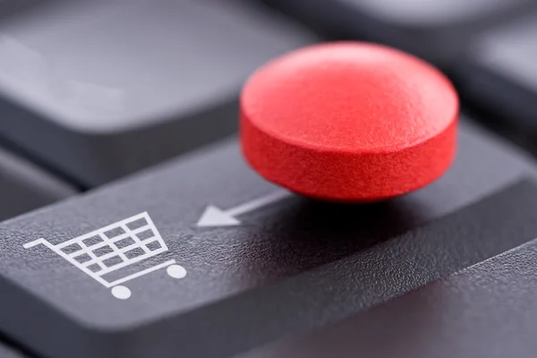 Red Pill and Shopping Cart on Computer Keyboard — Stock Photo, Image