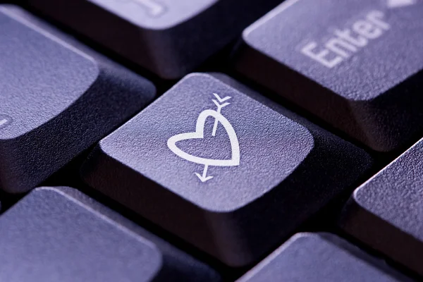 Heart and Arrow Symbol on computer key — Stock Photo, Image